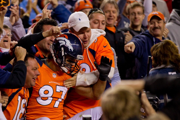 DENVER, CO - OCTOBER 28: Wide receiver Eric Decker #87 of the Denver Broncos celebrates in the stands with fans after scoring a touchdown during the second quarter against the New Orleans Saints at Sports Authority Field Field at Mile High on October 28, 2012 in Denver, Colorado. (Photo by Justin Edmonds/Getty Images)