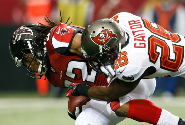 ATLANTA, GA - DECEMBER 30: Anthony Gaitor #26 of the Tampa Bay Buccaneers tackles Jacquizz Rodgers #32 of the Atlanta Falcons at Georgia Dome on December 30, 2012 in Atlanta, Georgia. (Photo by Kevin C. Cox/Getty Images)