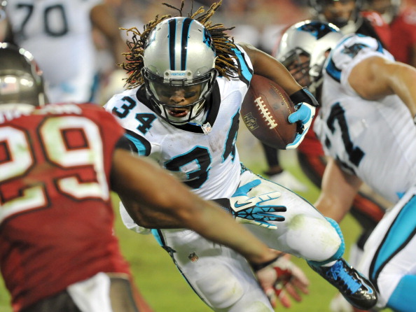 TAMPA, FL - OCTOBER 24:  Running back DeAngelo Williams #34 of the Carolina Panthers runs upfield against the Tampa Bay Buccaneers October 24, 2013 at Raymond James Stadium in Tampa, Florida. Carolina won 31 - 13. (Photo by Al Messerschmidt/Getty Images)
