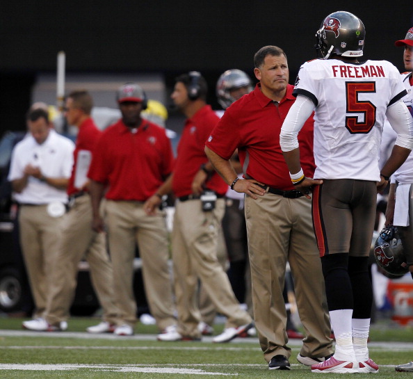 EAST RUTHERFORD, NJ - SEPTEMBER 16:  Head coach Greg Schiano talks with  Josh Freeman #5 of the Tampa Bay Buccaneers during a game against the New York Giants at MetLife Stadium on September 16, 2012 in East Rutherford, New Jersey.  (Photo by Jeff Zelevansky/Getty Images)