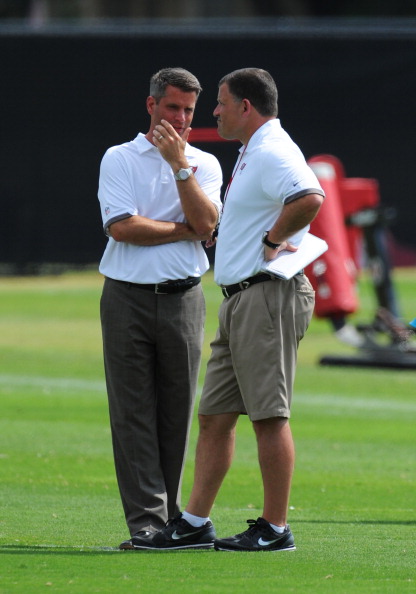 TAMPA, FL -  MAY 4: General manager Mark Dominik and coach Greg Schiano of the Tampa Bay Buccaneers watch a rookie practice at the Buccaneers practice facility May 4, 2012 in Tampa, Florida. (Photo by Al Messerschmidt/Getty Images)