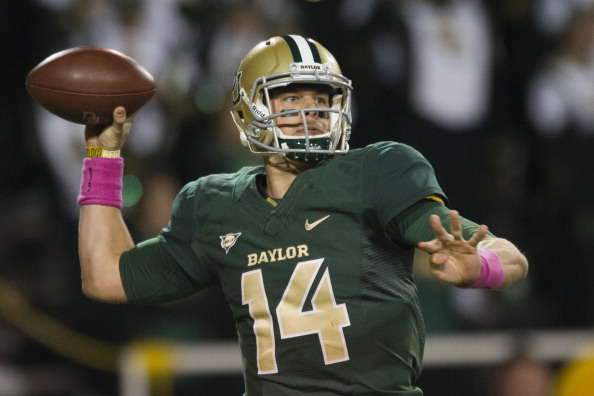 WACO, TX - OCTOBER 19: Bryce Petty #14 of the Baylor Bears drops back to throw a pass against the Iowa State Cyclones on October 19, 2013 at Floyd Casey Stadium in Waco, Texas.  (Photo by Cooper Neill/Getty Images)