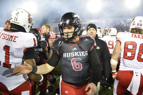 DEKALB, IL - NOVEMBER 13:  Jordan Lynch #6 of the Northern Illinois Huskies shakes hands with Ball State Cardinals players at Huskie Stadium on November 13, 2013 in DeKalb, Illinois. Northern Illinois defeated Ball State 48-27.  (Photo by Brian Kersey/Getty Images)