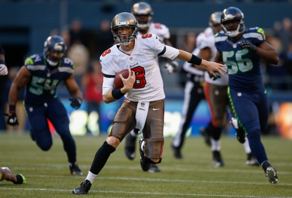 SEATTLE, WA - NOVEMBER 03:  Quarterback Mike Glennon #8 of the Tampa Bay Buccaneers rushes against the Seattle Seahawks at CenturyLink Field on November 3, 2013 in Seattle, Washington. The Seahawks defeated the Buccaneers 27-24 in overtime.  (Photo by Otto Greule Jr/Getty Images)