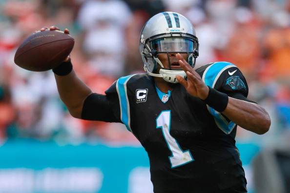 MIAMI GARDENS, FL - NOVEMBER 24:  Cam Newton #1 of the Carolina Panthers attempts to pass the ball in the second quarter against the Miami Dolphins at Sun Life Stadium on November 24, 2013 in Miami Gardens, Florida.  (Photo by Chris Trotman/Getty Images)