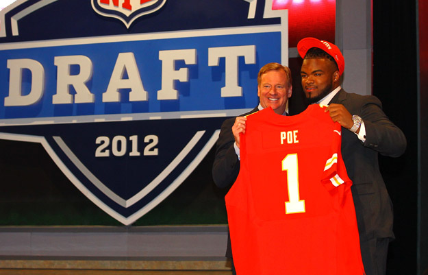 NEW YORK, NY - APRIL 26:  Dontari Poe of Memphis holds up a jersey as he stands on stage with NFL Commissioner Roger Goodell after he was selected #11 overall by the Kansas City Chiefs in the first round of the 2012 NFL Draft at Radio City Music Hall on April 26, 2012 in New York City.