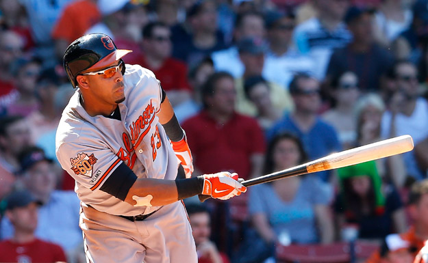 BOSTON, MA - JULY 6:  Nelson Cruz #23 of the Baltimore Orioles singles in a run against the Boston Red Sox in the seventh inning at Fenway Park on July 6, 2014 in Boston, Massachusetts.  