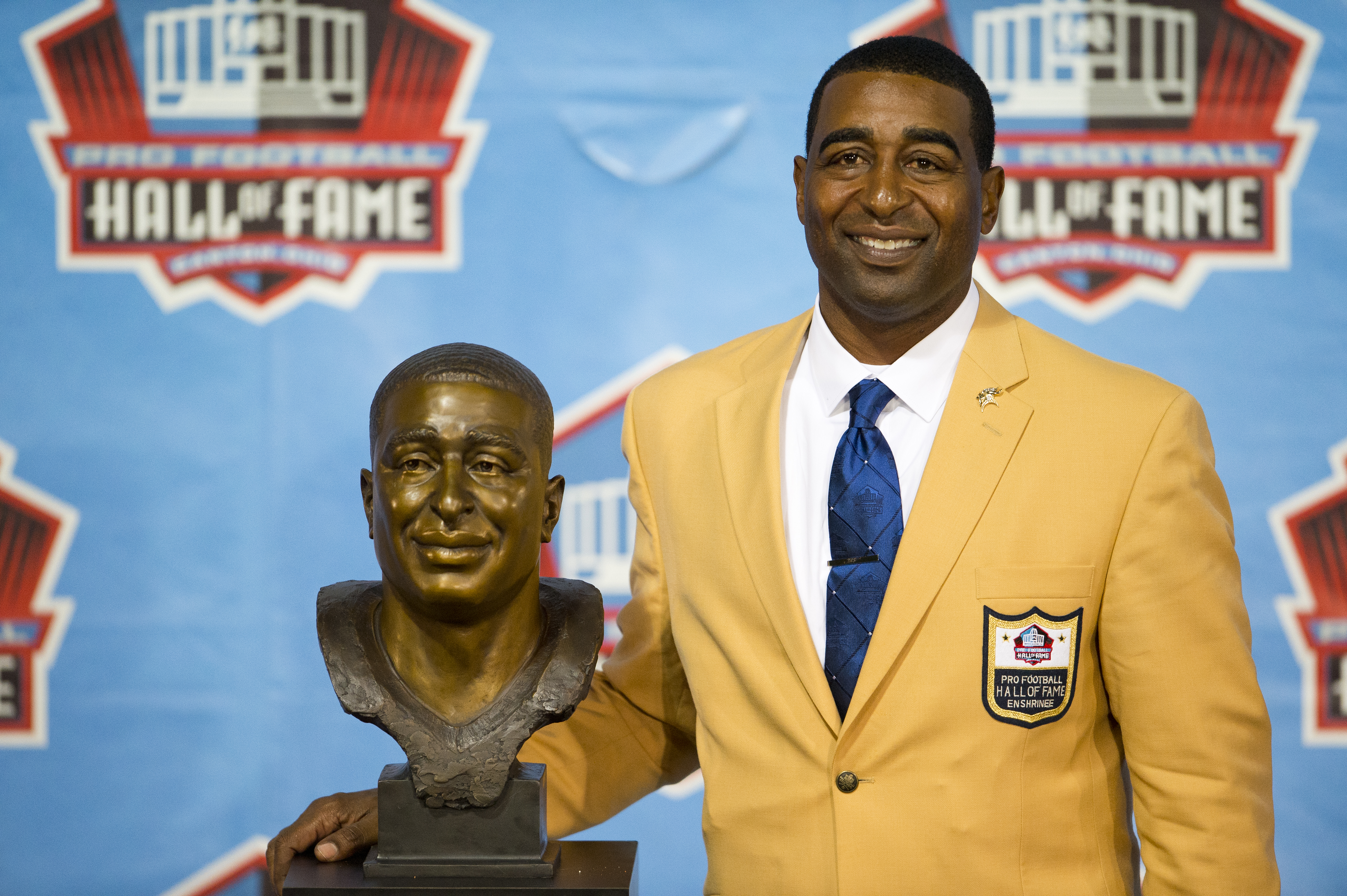 CANTON, OH - AUGUST 3: Former receiver Cris Carter of the Minnesota Vikings poses with his bust during the NFL Class of 2013 Enshrinement Ceremony at Fawcett Stadium on Aug. 3, 2013 in Canton, Ohio. (Photo by Jason Miller/Getty Images)