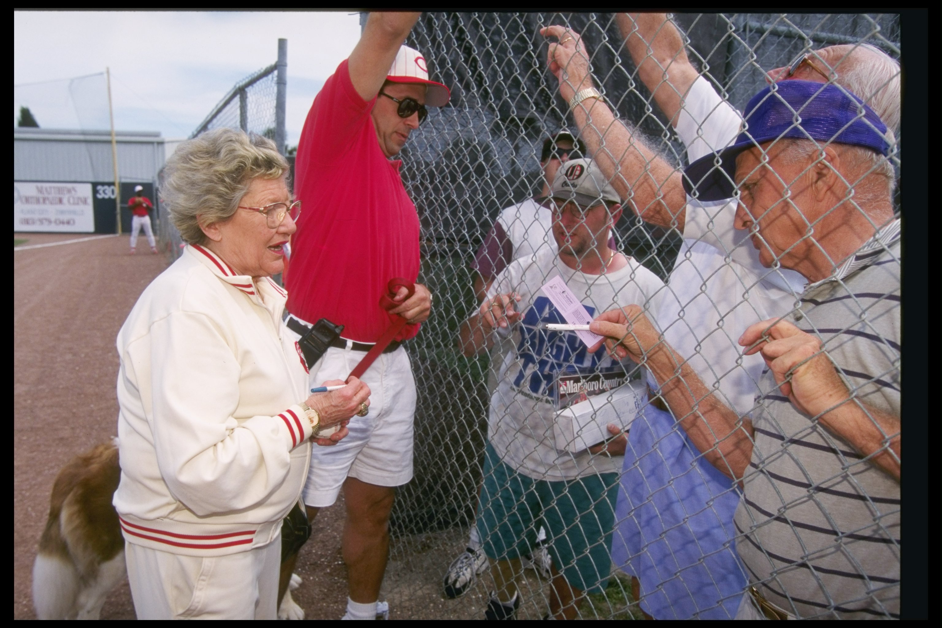 28 Feb 1997:  Cincinnati Reds owner Marge Schott signing autographs  during a spring training game against the Texas Rangers in Plant City, Florida. (photo: Allsport/Getty Images)