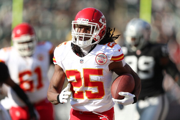 Jamaal Charles #25 of the Kansas City Chiefs runs for a touchdown against the Oakland Raiders at O.co Coliseum on December 15, 2013 in Oakland, California.  (Photo by Jed Jacobsohn/Getty Images)