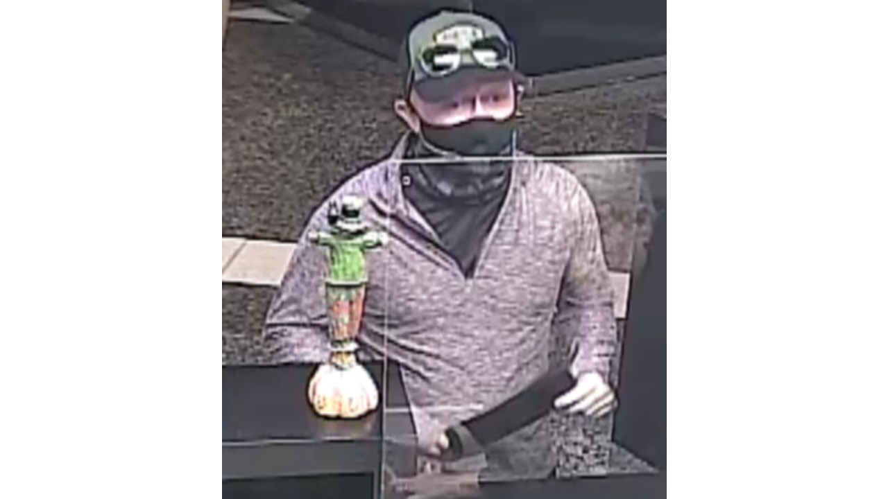 Detectives Searching For A Suspect Who Attempted To Rob A Bank